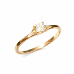 Gold ring with a diamond on a white background