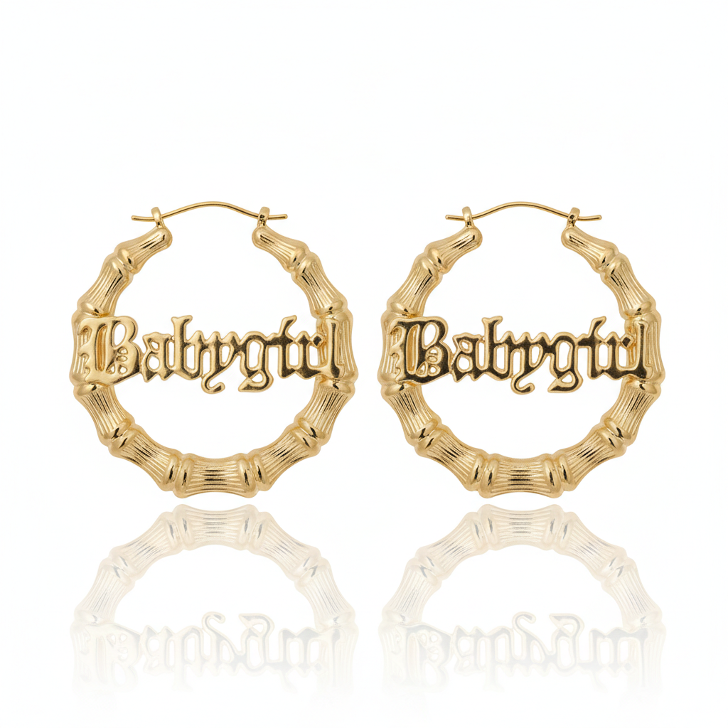 Gold hoop earrings with 'Babycity' engraving on a white background