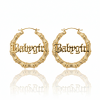Gold hoop earrings with 'Babycity' engraving on a white background