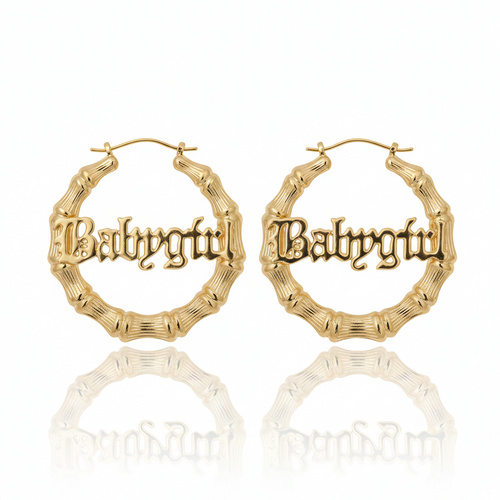 Gold hoop earrings with 'Babycity' engraving on a white background