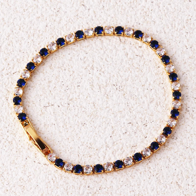 Bracelet with blue and clear gemstones on a light background
