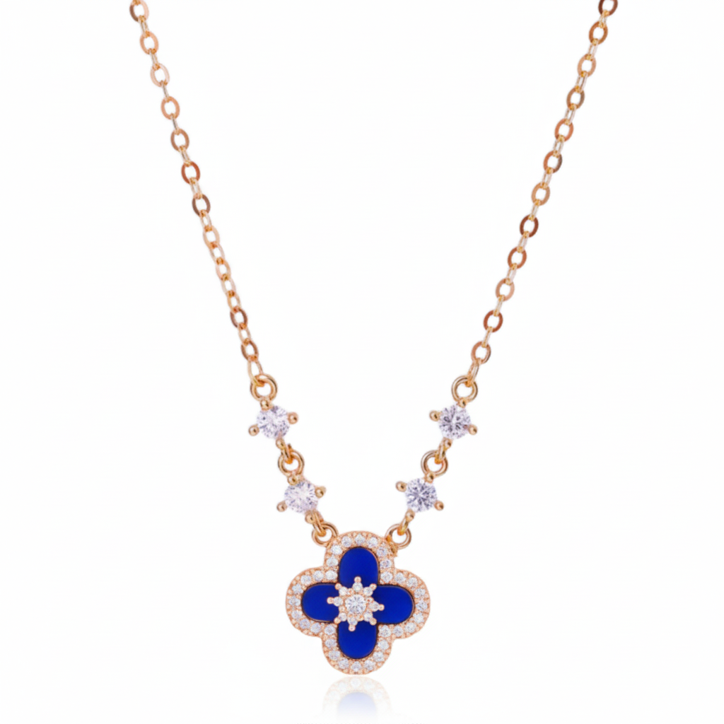 Necklace with a blue clover-shaped pendant and rose gold chain on a white background