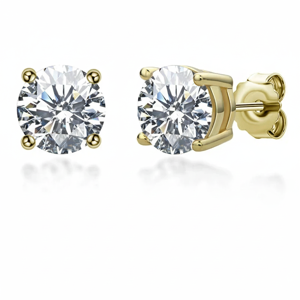 Gold stud earrings with clear gemstones on a white background