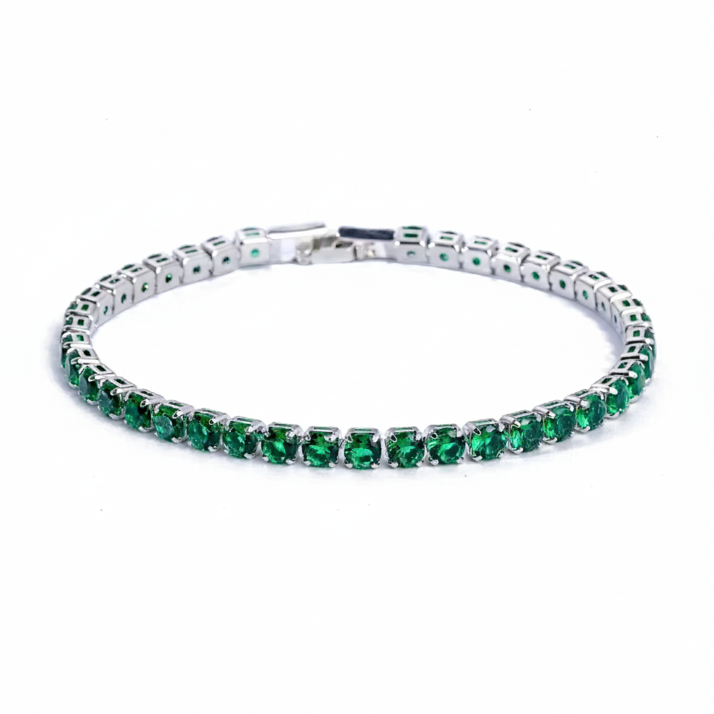 Silver bracelet with green gemstones on a white background