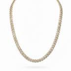 Gold necklace with a white background