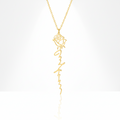 Gold necklace with a rose design on a white background
