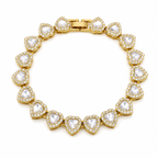 Gold bracelet with heart-shaped clear stones on a white background