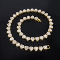 Gold bracelet with heart-shaped diamond stones on a black background