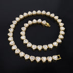 Gold bracelet with heart-shaped diamond stones on a black background