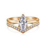 Rose gold ring with a pear-shaped diamond and smaller diamonds on a white background