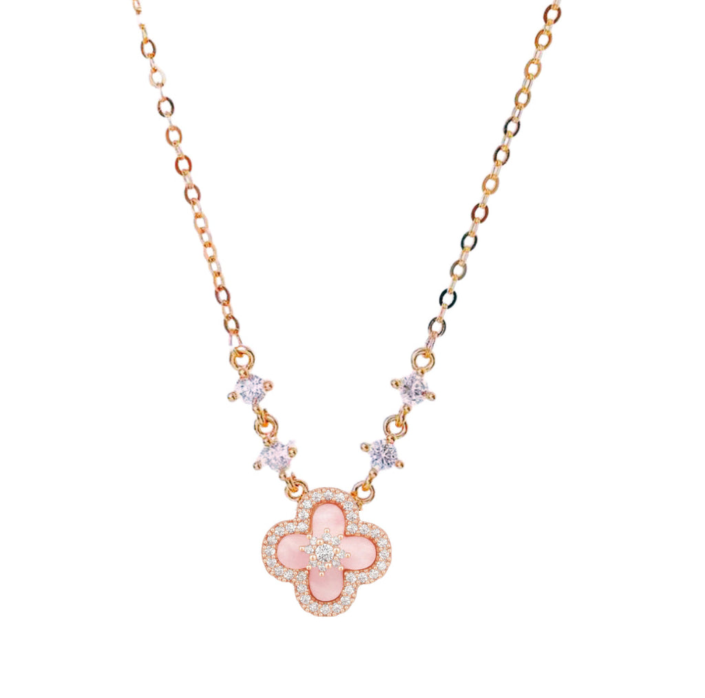 Necklace with a pink clover-shaped pendant on a white background