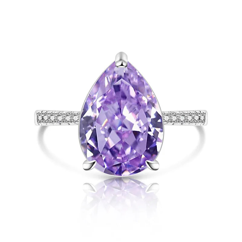 Ring with a purple gemstone and diamond-studded band on a white background