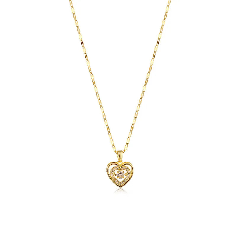 Gold heart-shaped pendant necklace on a white background