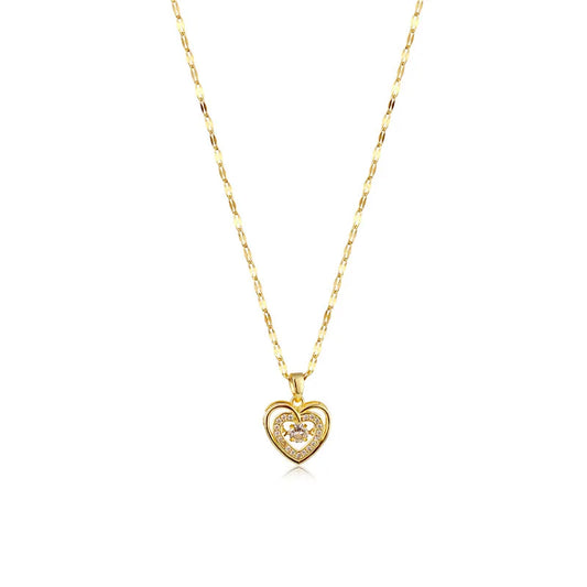 Gold heart-shaped pendant necklace on a white background