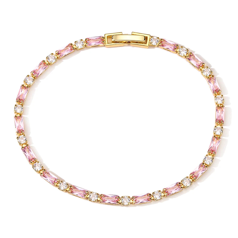 Bracelet with pink and gold beads on a white background