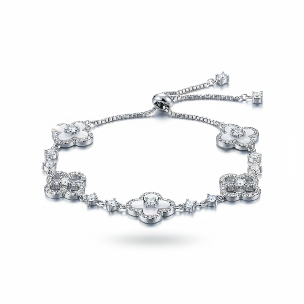 Silver bracelet with floral designs on a white background