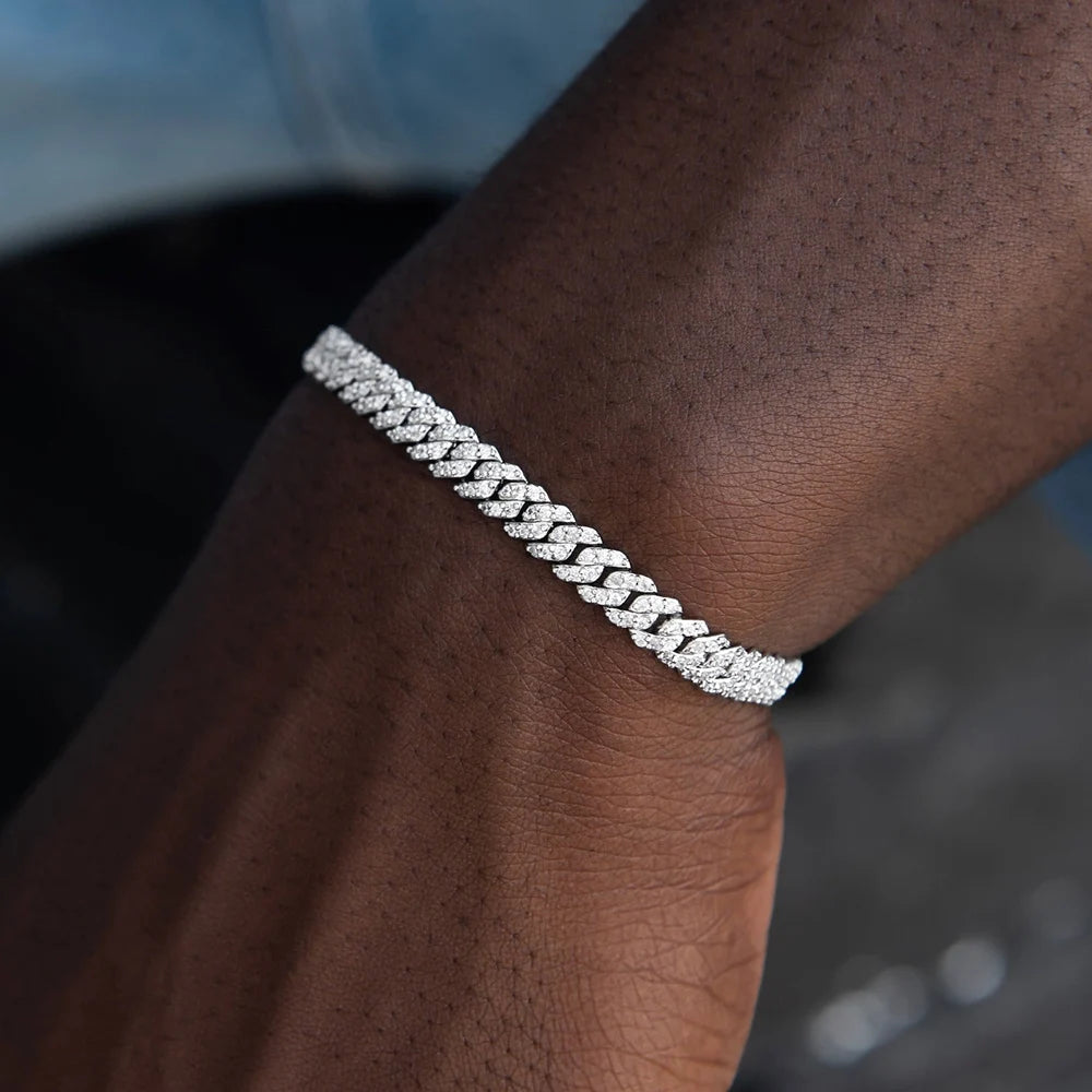 Silver bracelet on a wrist with a blurred background