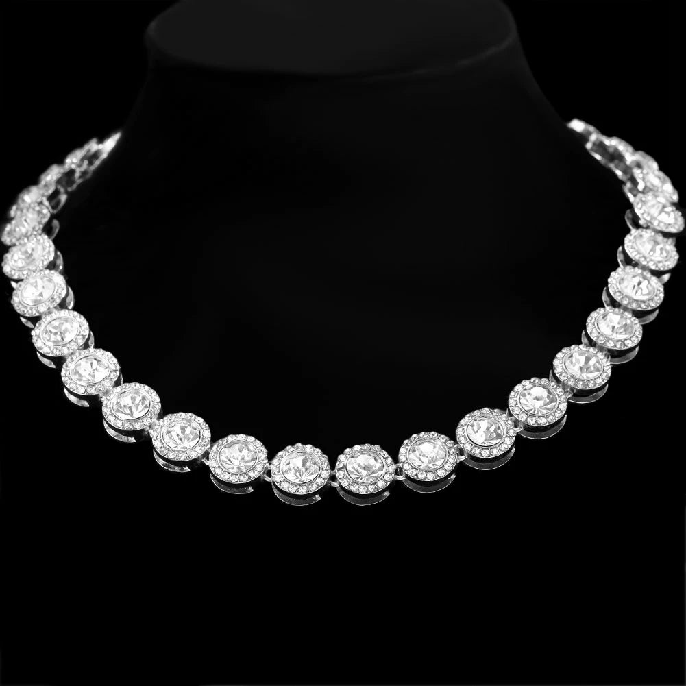 Silver necklace with clear stones on a black background