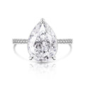 Pear-shaped diamond ring with a white background