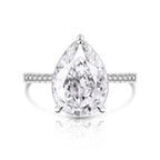 Pear-shaped diamond ring with a white background